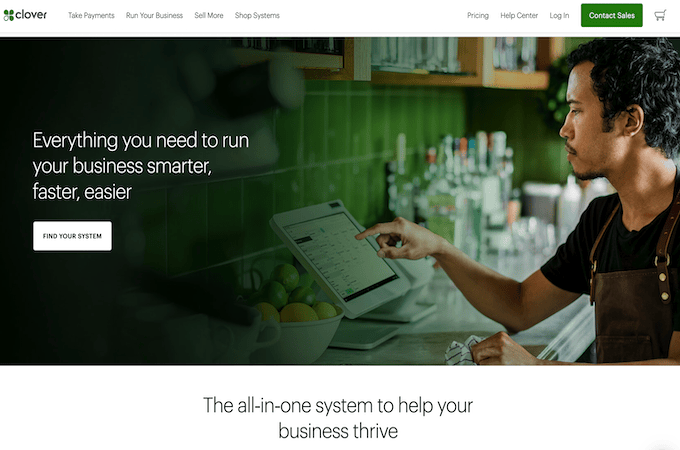 Screenshot of Clover homepage with a man using a touch screen POS system